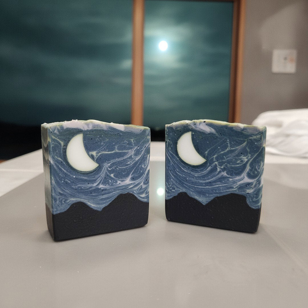 Midnight Hour handmade cold process soap with stormy night sky, moon, black hills and stars